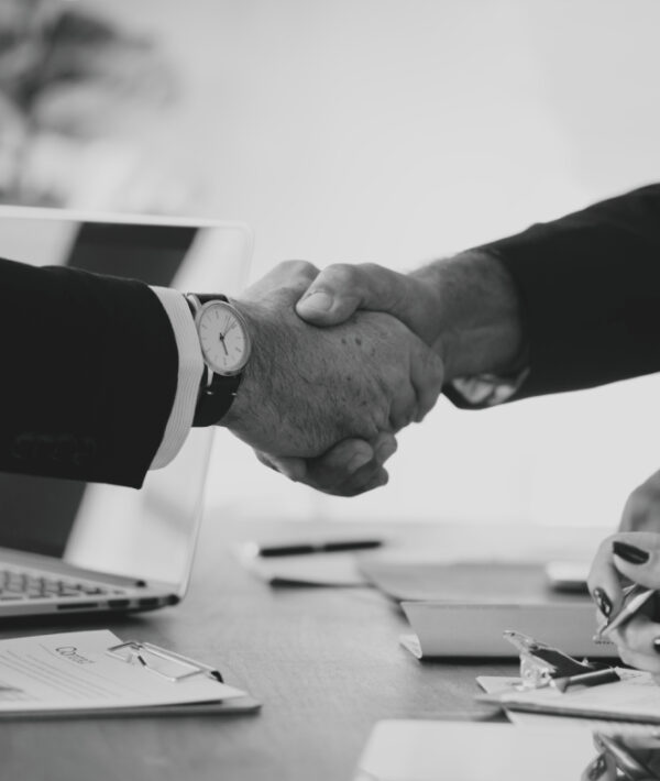 Business people shaking hands together